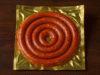 Empaque rojo de salchichas para asar marca KIR, 800g.