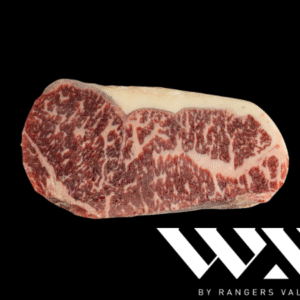 Corte New York Wagyu WX Cross en fondo negro con marmoleo intenso y etiqueta WX by Rangers Valley.